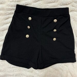 Black shorts with gold buttons